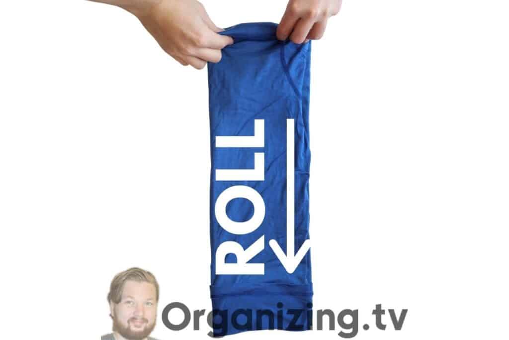 rolling a folded in shirt from the bottom