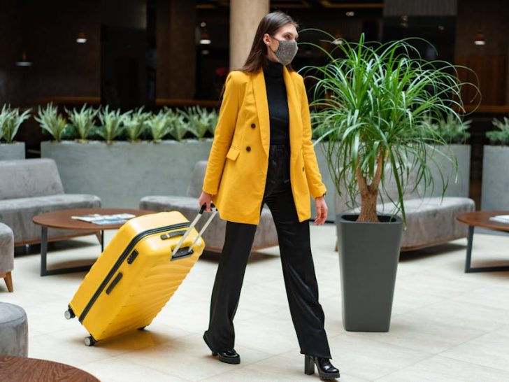 Business traveler with carry-on luggage.