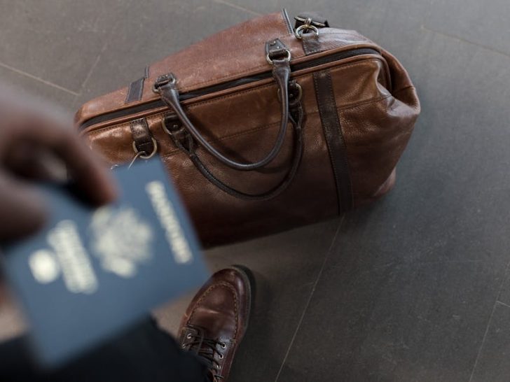 Different types of travelers all using carry-on bags.