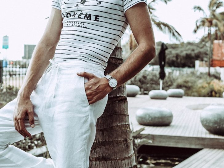 Well-dressed man in fitted trousers showing how fabric choice and fit create a clean masculine silhouette