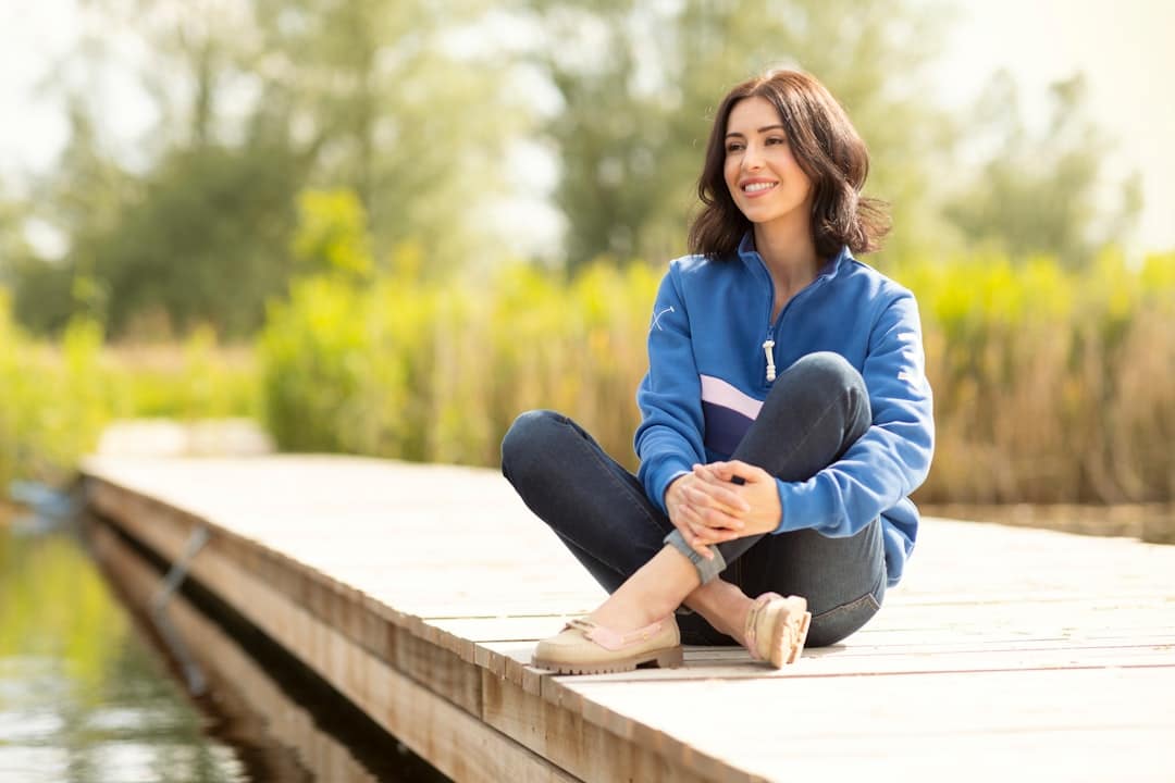 Woman wearing well-fitted jeans in a casual outfit showing how the right denim cut flatters your shape. Photo by Rydale Clothing on Unsplash