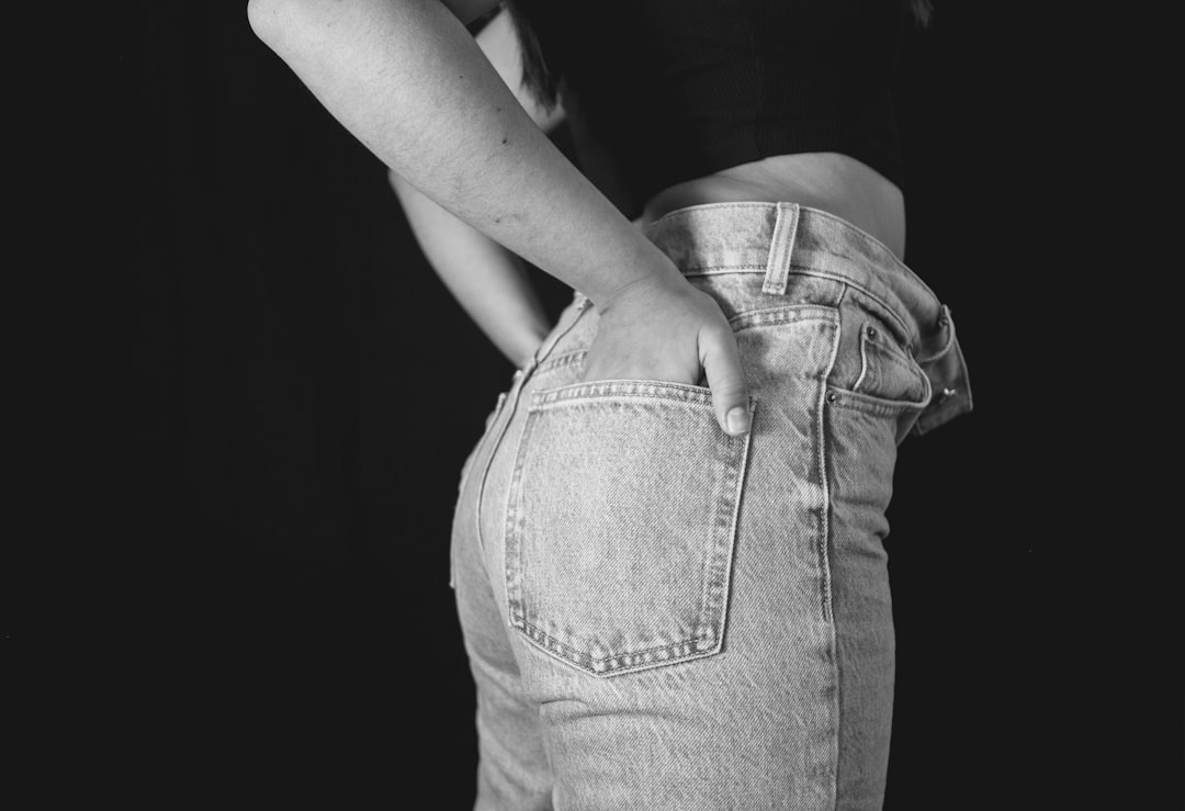 Side profile of a woman in jeans showing how the fit affects the appearance of the bum