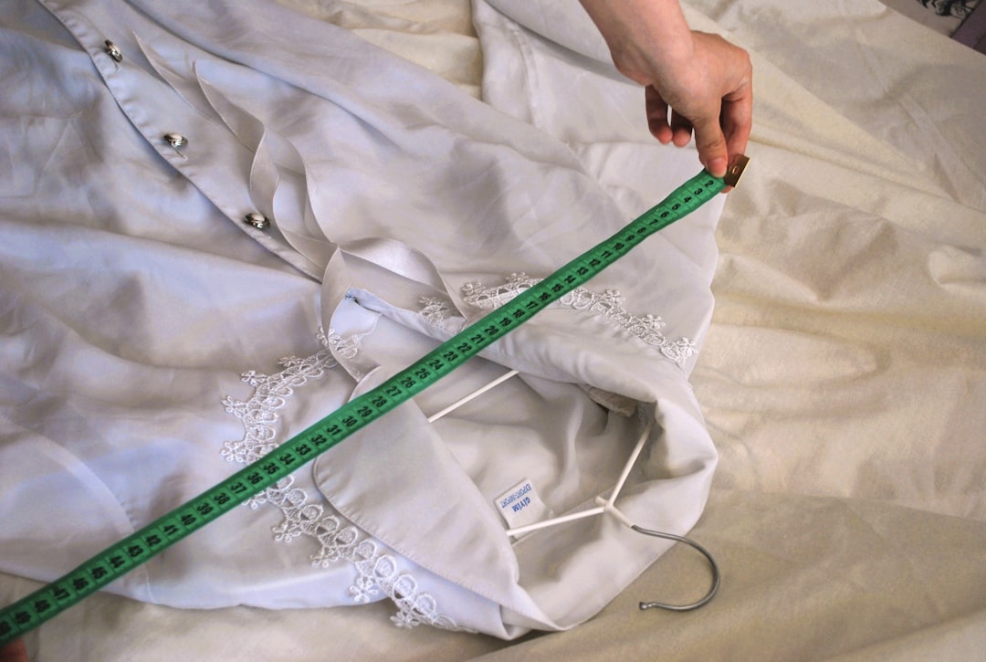 Measuring a shirt with a tape measure for proper fit